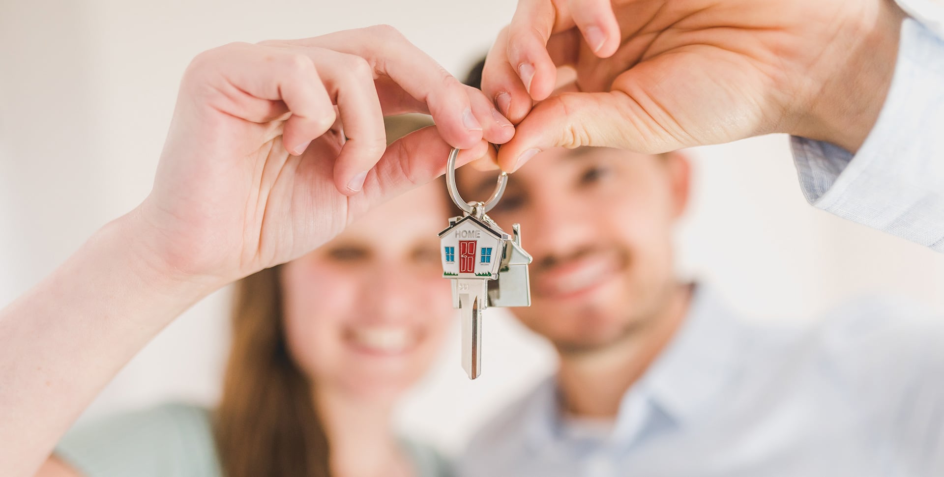 Photo of happy couple holding key